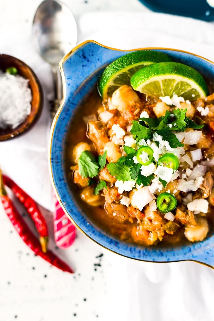 This Slow Cooker Posole (or Pozole) is a traditional Mexican stew made with hominy and pork and a flavorful broth that's super easy to make!