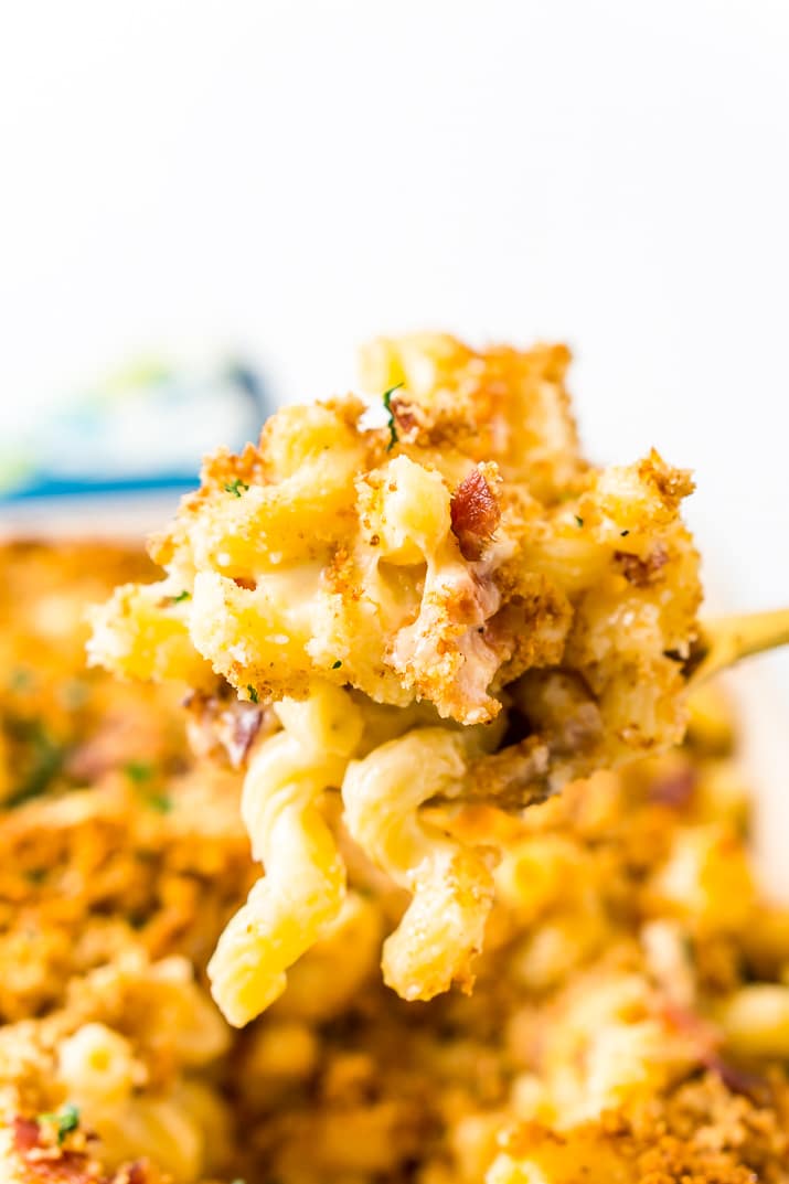 Serving spoon with three cheese bacon mac and cheese