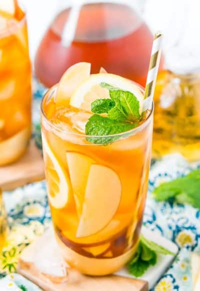 This Homemade Apple Iced Tea is made with freshly brewed black tea, sweet apple juice, fresh apple slices, and a squeeze of lemon for a refreshing summer drink that's easy to make. This flavored iced tea is naturally sweetened by the fruit juice and great for a party!