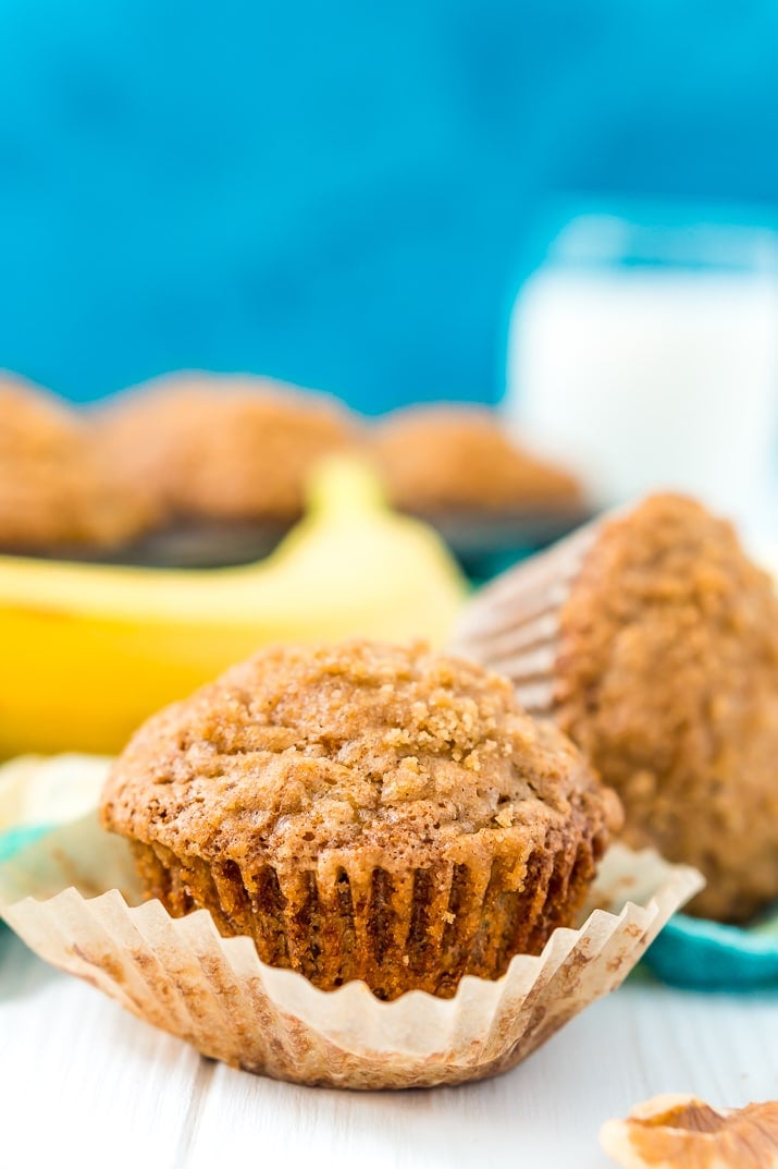 These Banana Muffins are loaded with crunchy walnuts and sweet cinnamon, then topped with a sugary crumble no one can resist!