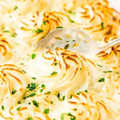 This Easy Fish Pie is inspired by the classic British dish. It's loaded with flaky salmon, tender veggies, and topped with creamy mashed potatoes for an easy dinner option!
