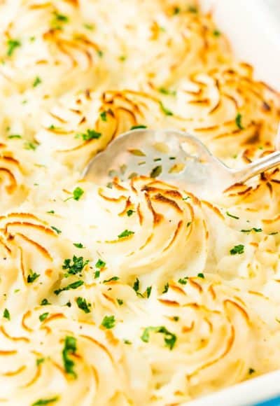 This Easy Fish Pie is inspired by the classic British dish. It's loaded with flaky salmon, tender veggies, and topped with creamy mashed potatoes for an easy dinner option!
