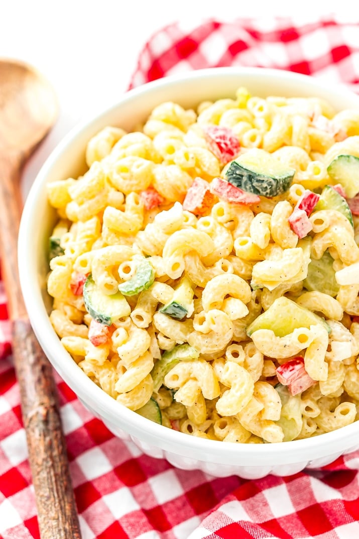 Classic Macaroni Salad is the perfect side dish for summer! Tender elbow macaroni is tossed in a creamy dressing and loaded with veggies life carrot, cucumber, and bell pepper and seasoning!