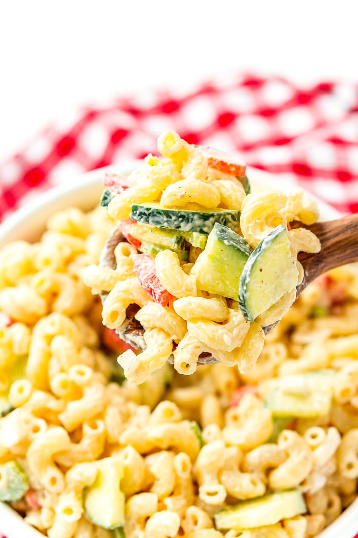 Classic Macaroni Salad is the perfect side dish for summer! Tender elbow macaroni is tossed in a creamy dressing and loaded with veggies life carrot, cucumber, and bell pepper and seasoning!
