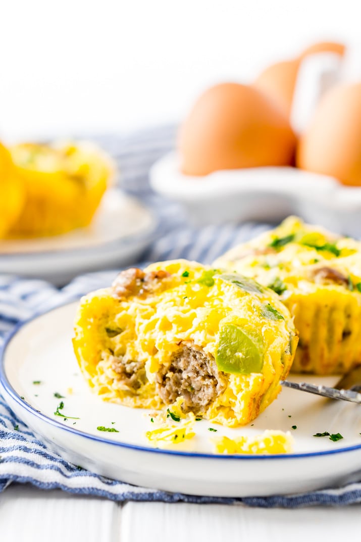 This Crustless Mini Quiche Recipe made with eggs, sausage, green peppers, and cheese are perfect for quick weekday breakfasts or weekend brunch! Make them ahead of time and freeze them for when you want them!