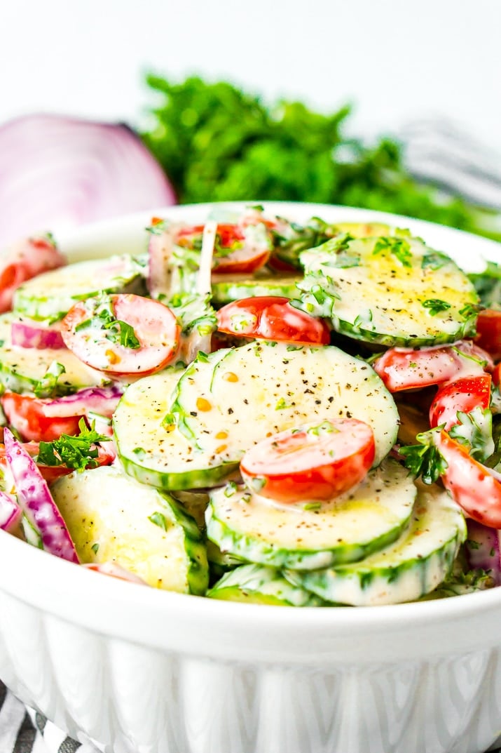 This Cucumber Tomato Salad is a simple and refreshing side dish that can be made with a creamy Italian dressing or a vinegar dressing.