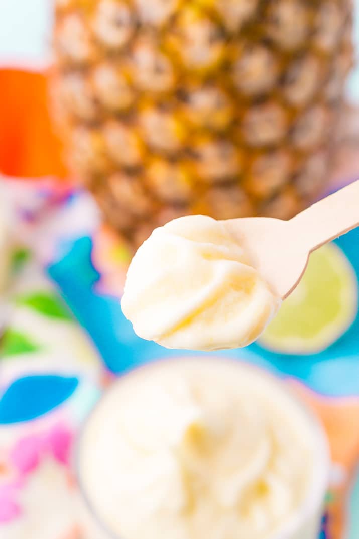 This Dole Whip recipe is a copycat of the famous Disney soft serve pineapple, banana, and coconut treat we all know and love! But you can make it right at home with just 4 ingredients and a blender!