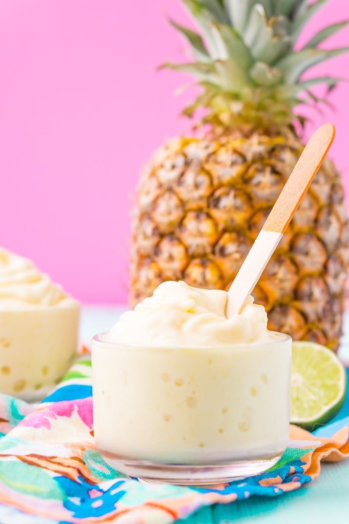 This Dole Whip recipe is a copycat of the famous Disney soft serve pineapple, banana, and coconut treat we all know and love! But you can make it right at home with just 4 ingredients and a blender!