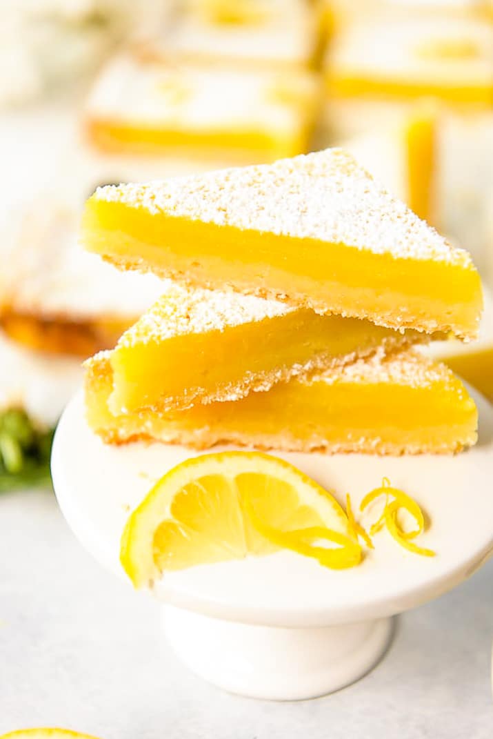 Tart lemon custard & subtly sweet shortbread make these bright and tasty Lemon Bars the perfect summer treat! These highly portable dessert bars can be cut to any size you need, and are great for all your picnics in the park, outdoor barbecues, and pool parties all season long.