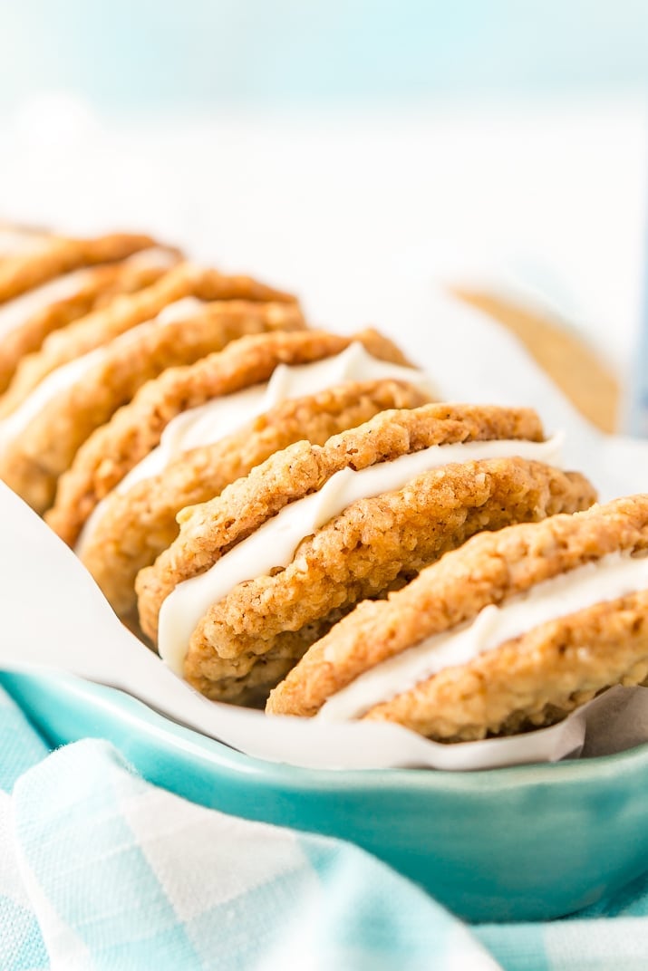 These Oatmeal Cream Pies are soft and chewy just like the ones you grew up with. Sweet oatmeal cookies sandwich a creamy vanilla filling for an easy and delicious dessert!