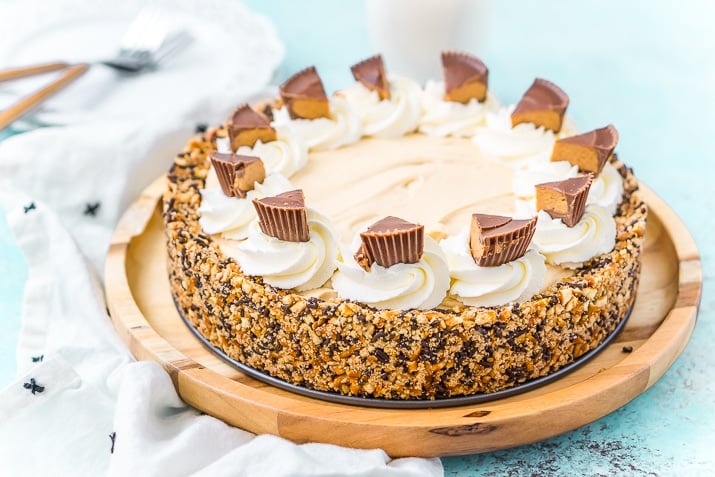 This No Bake Peanut Butter Pie is an easy and sinful dessert recipe made with a pretzel crust, a creamy peanut butter filling, and topped with peanut butter cups.