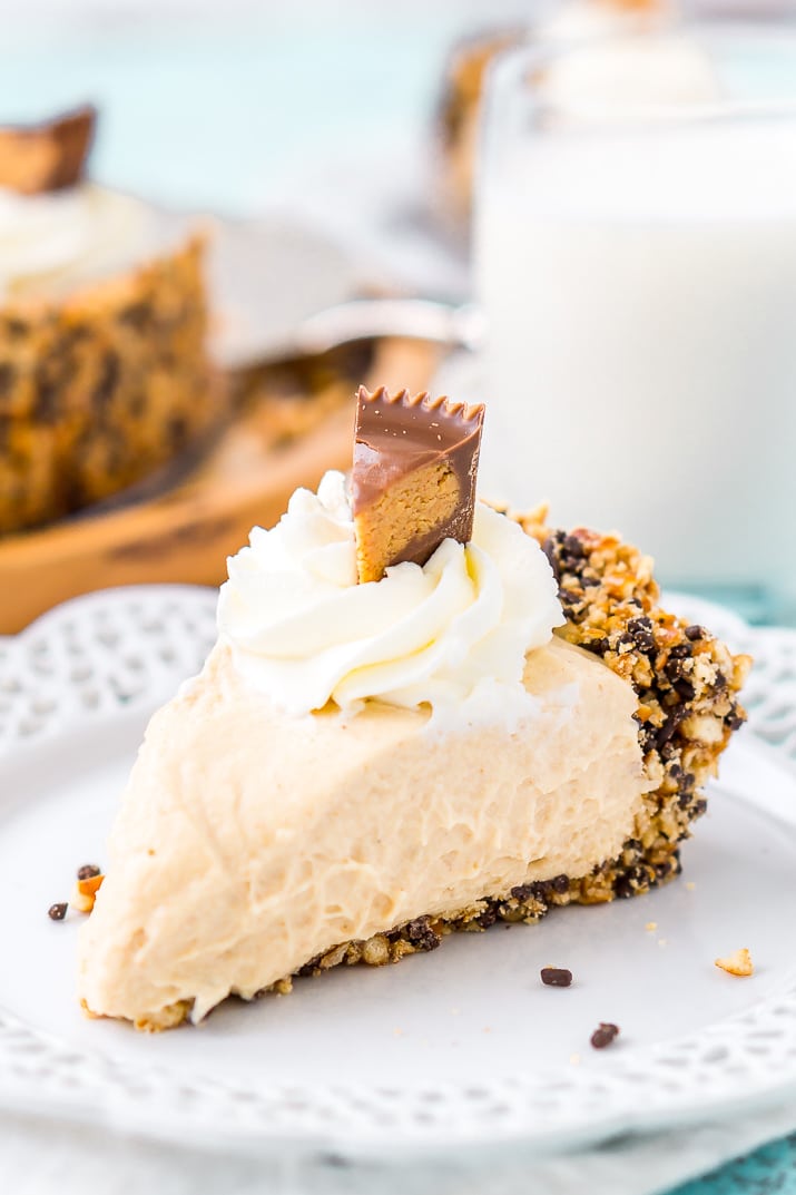 This No Bake Peanut Butter Pie is an easy and sinful dessert recipe made with a pretzel crust, a creamy peanut butter filling, and topped with peanut butter cups.