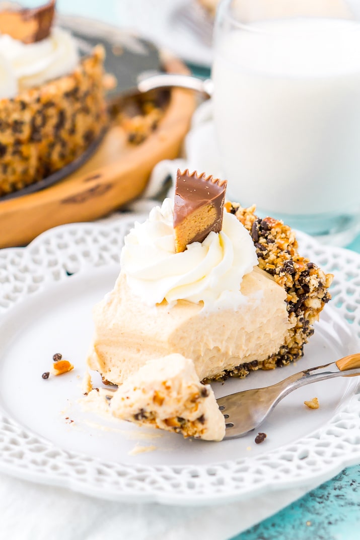 This No Bake Peanut Butter Pie is an easy and sinful dessert recipe made with a pretzel crust, a creamy peanut butter filling, and topped with peanut butter cups.