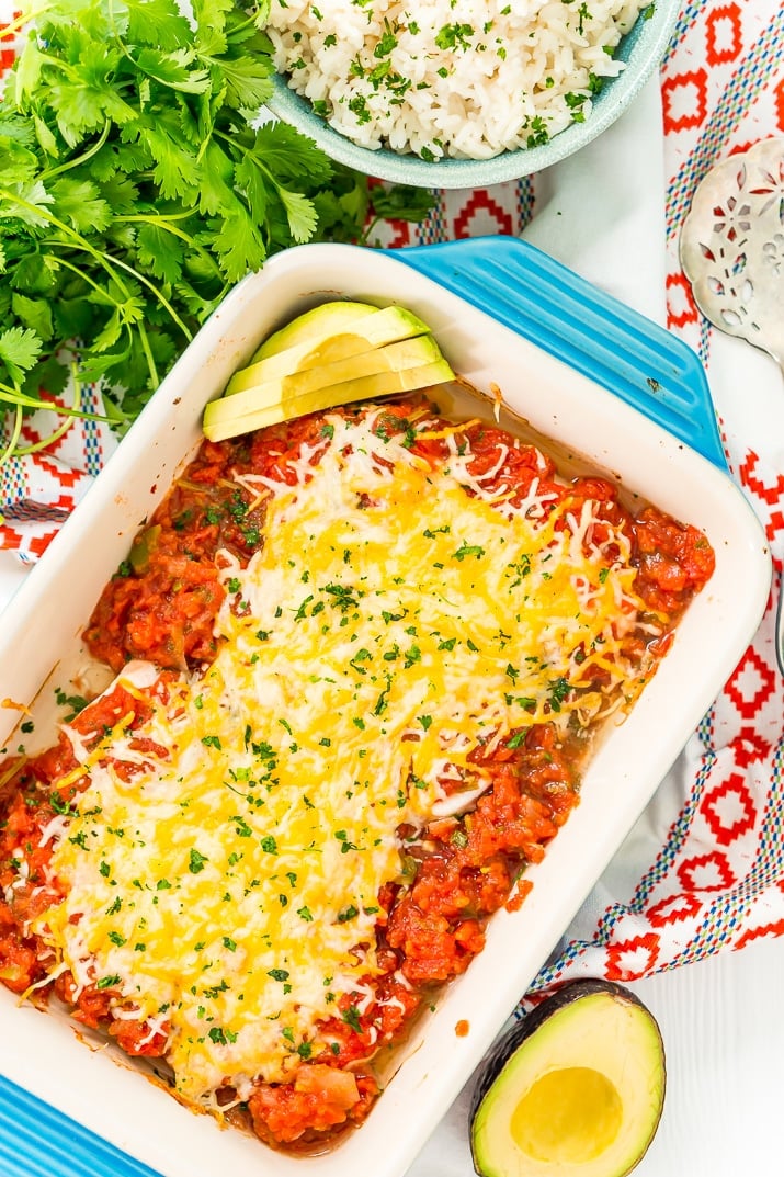 Overhead photo of salsa chicken in a blue baking dish.