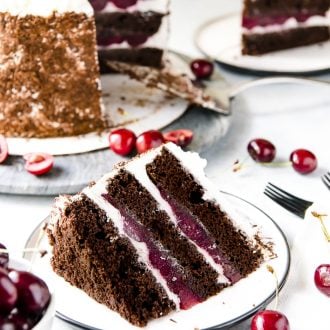 Decadent chocolate cake + boozy cherry filling + sweet whipped cream = a recipe for Black Forest Cake perfection! You're gonna love this classic German dessert!