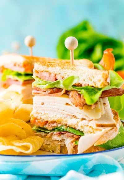 This Club Sandwich Recipe is an easy and classic sandwich made with hickory smoked turkey breast, Swiss cheese, thick-cut bacon, lettuce, tomato, and mayonnaise.