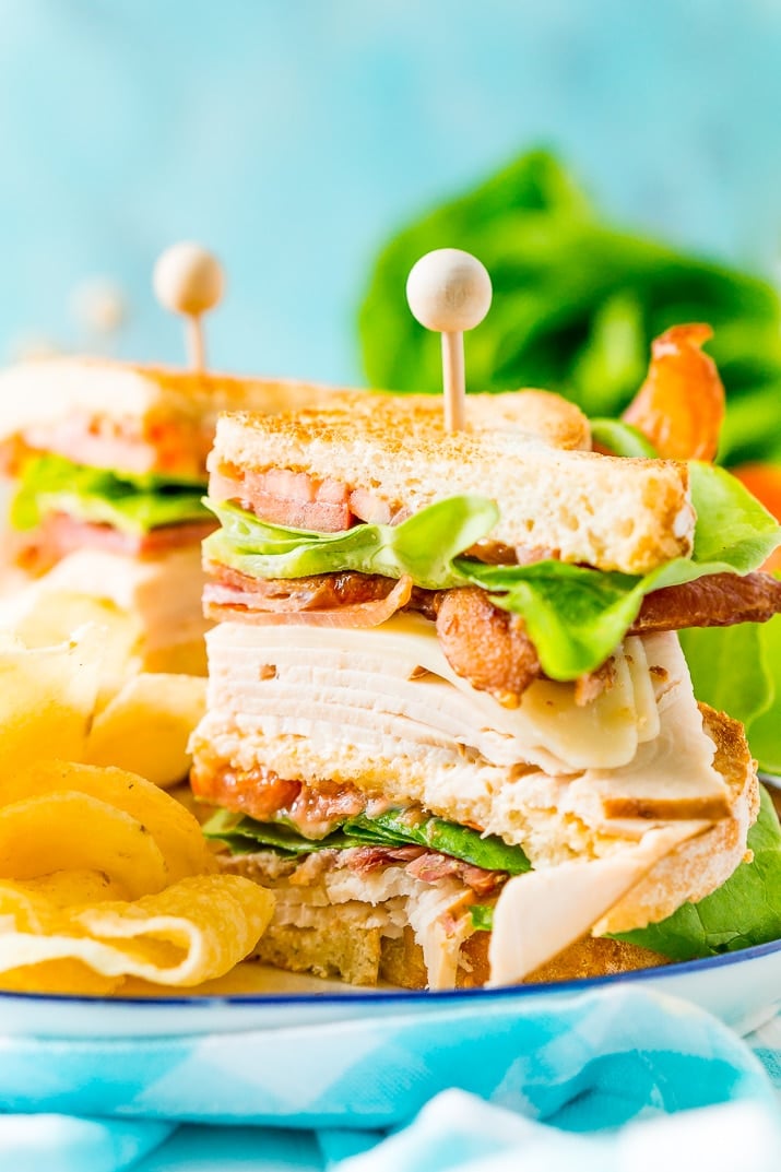 This Club Sandwich Recipe is an easy and classic sandwich made with hickory smoked turkey breast, Swiss cheese, thick-cut bacon, lettuce, tomato, and mayonnaise.