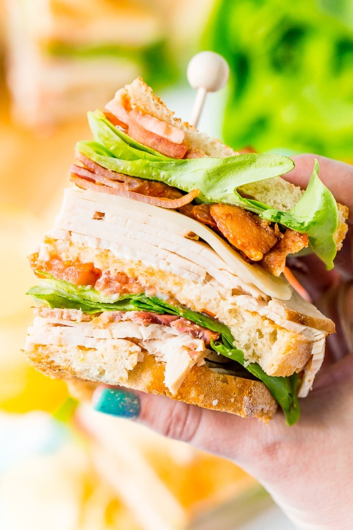 This Club Sandwich Recipe is an easy and classic sandwich made with hickory smoked turkey breast, Swiss cheese, thick-cut bacon, lettuce, tomato, and mayonnaise.