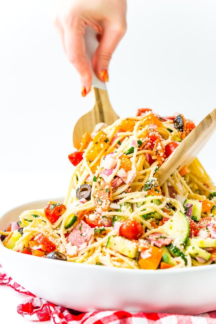 Spaghetti Salad is loaded with veggies, pepperoni, and salami, then tossed in an oil and vinegar dressing. Topped with a sprinkle of parsley and lots of Parmesan cheese, it’s a perfect summer meal or side dish!