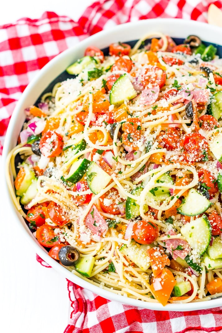 Spaghetti Salad is loaded with veggies, pepperoni, and salami, then tossed in an oil and vinegar dressing. Topped with a sprinkle of parsley and lots of Parmesan cheese, it’s a perfect summer meal or side dish!