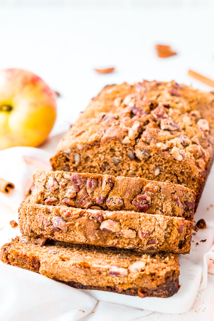 This simple Applesauce Bread is the perfect way to enjoy some of fall’s best flavors. Laced with warm spices, brown sugar, and chopped pecans, this quick bread is a delicious treat to make and share during the autumn season.