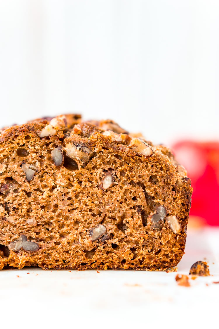 This simple Applesauce Bread is the perfect way to enjoy some of fall’s best flavors. Laced with warm spices, brown sugar, and chopped pecans, this quick bread is a delicious treat to make and share during the autumn season.