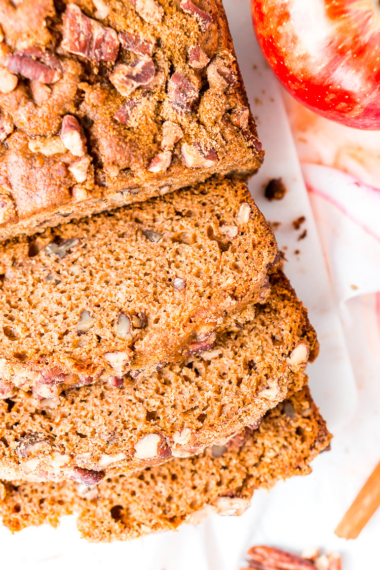 This simple Applesauce Bread is the perfect way to enjoy some of fall’s best flavors. Laced with warm spices, brown sugar, and chopped pecans, this quick bread is a delicious treat to make and share during the autumn season.