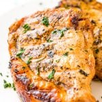 This Pork Chop Marinade makes meat juicy, tender, and super flavorful. Made with apple cider vinegar, olive oil, garlic powder, ground mustard, coriander, sea salt, brown sugar and honey, you can whip it up for summer cookouts or weeknight dinners.