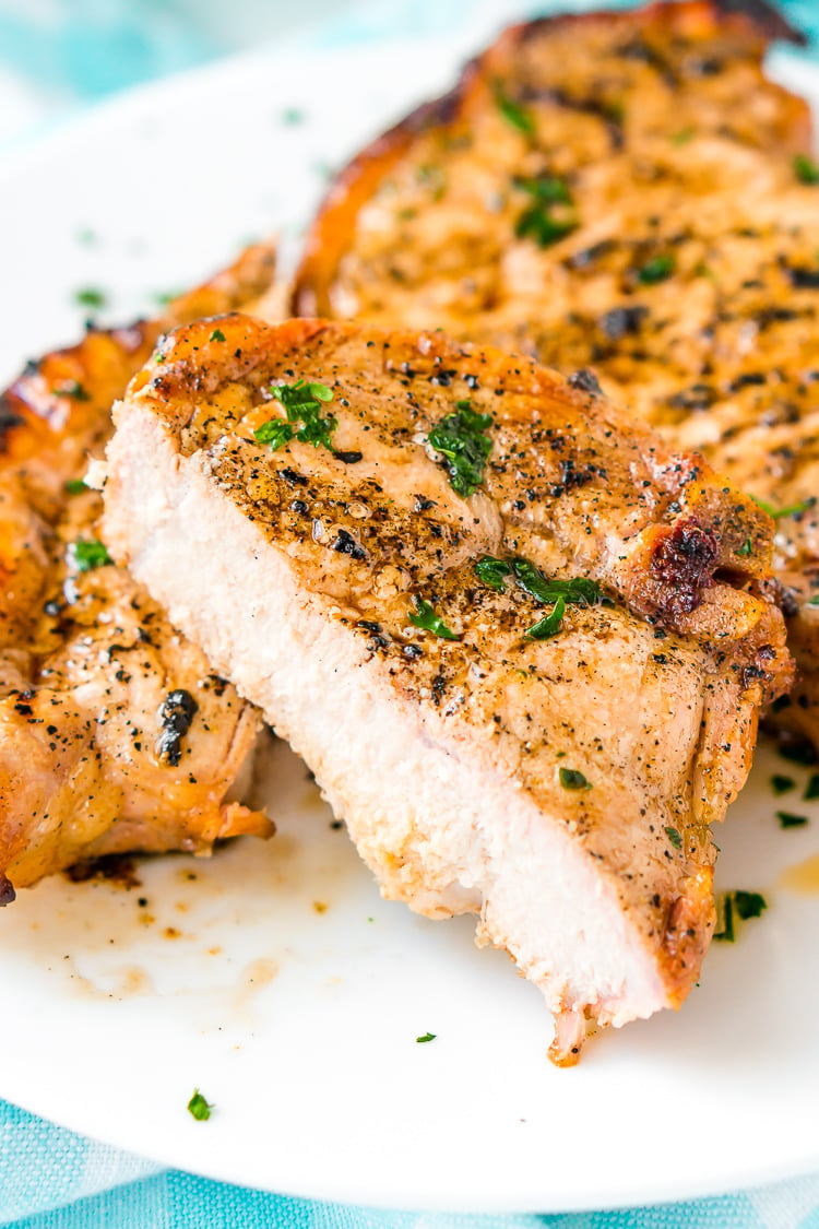 This Pork Chop Marinade makes meat juicy, tender, and super flavorful. Made with apple cider vinegar, olive oil, garlic powder, ground mustard, coriander, sea salt, brown sugar and honey, you can whip it up for summer cookouts or weeknight dinners.