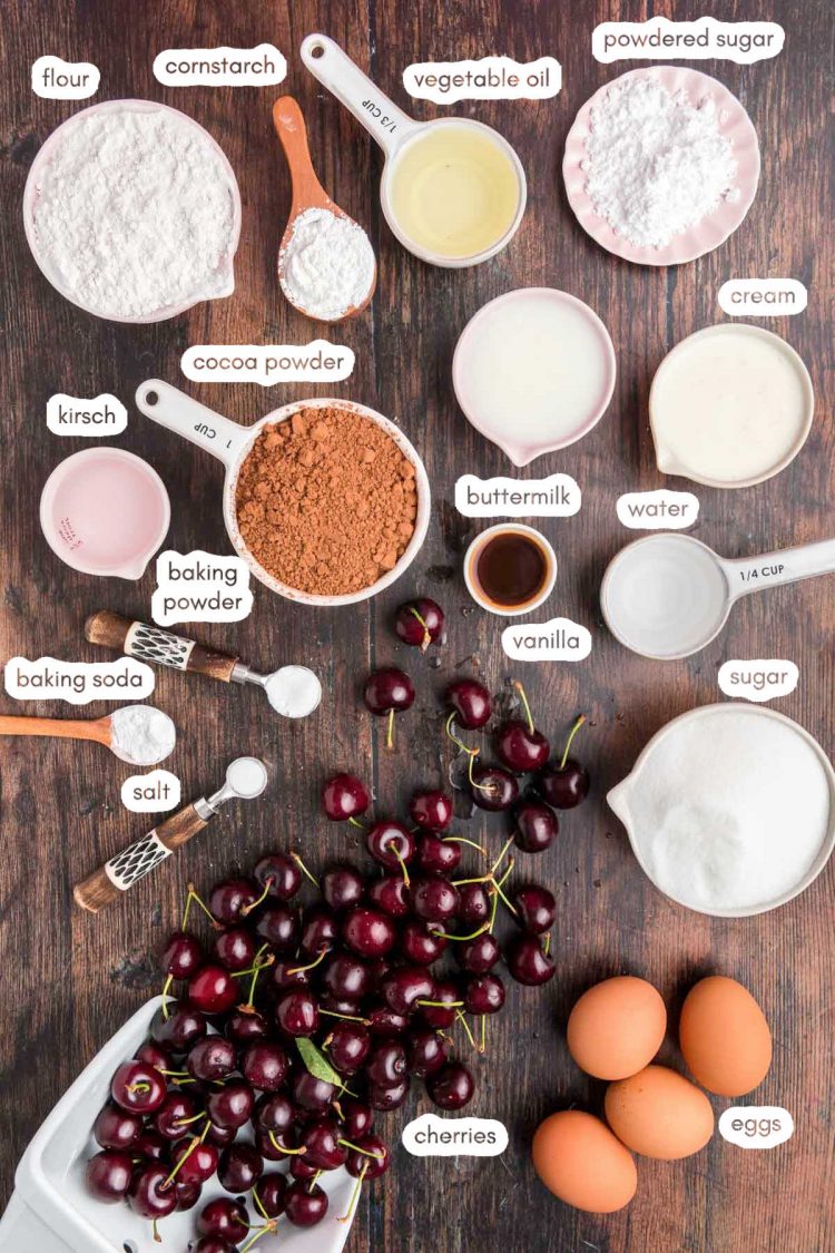 Overhead photo of ingredients to make black forest cake prepped on a wooden counter.