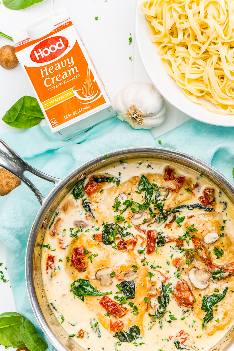 Creamy Tuscan Chicken is a gourmet homemade meal that takes just 30 minutes! Made with chicken, sundried tomatoes, spinach, mushrooms, spices, cheese, and heavy cream, this is a perfect family-friendly recipe to whip up on any night of the week.