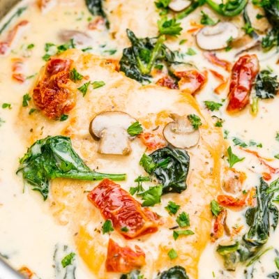 Creamy Tuscan Chicken is a gourmet homemade meal that takes just 30 minutes! Made with chicken, sundried tomatoes, spinach, mushrooms, spices, cheese, and heavy cream, this is a perfect family-friendly recipe to whip up on any night of the week.
