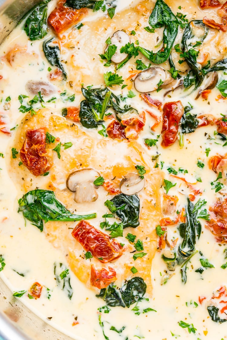 Creamy Tuscan Chicken is a gourmet homemade meal that takes just 30 minutes! Made with chicken, sundried tomatoes, spinach, mushrooms, spices, cheese, and heavy cream, this is a perfect family-friendly recipe to whip up on any night of the week.