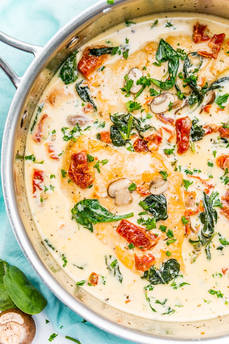 Creamy Tuscan Chicken is a gourmet homemade meal that takes just 30 minutes! Made with chicken, sundried tomatoes, spinach, mushrooms, spices, cheese, and heavy cream, this is a perfect family-friendly recipe to whip up on any night of the week.