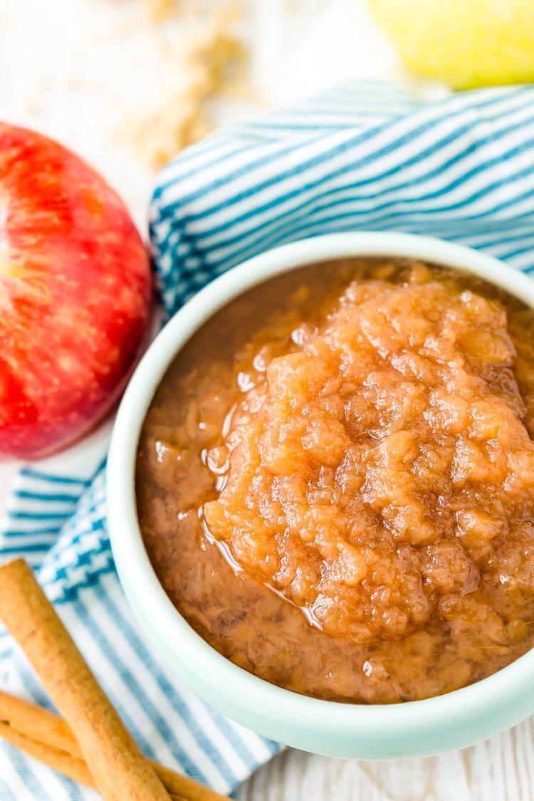 This Homemade Applesauce recipe is delicious and super easy to make! Made with apples, white and brown sugars, vanilla, cinnamon, and lemon juice, it’s the perfect way to enjoy fresh-picked apples.