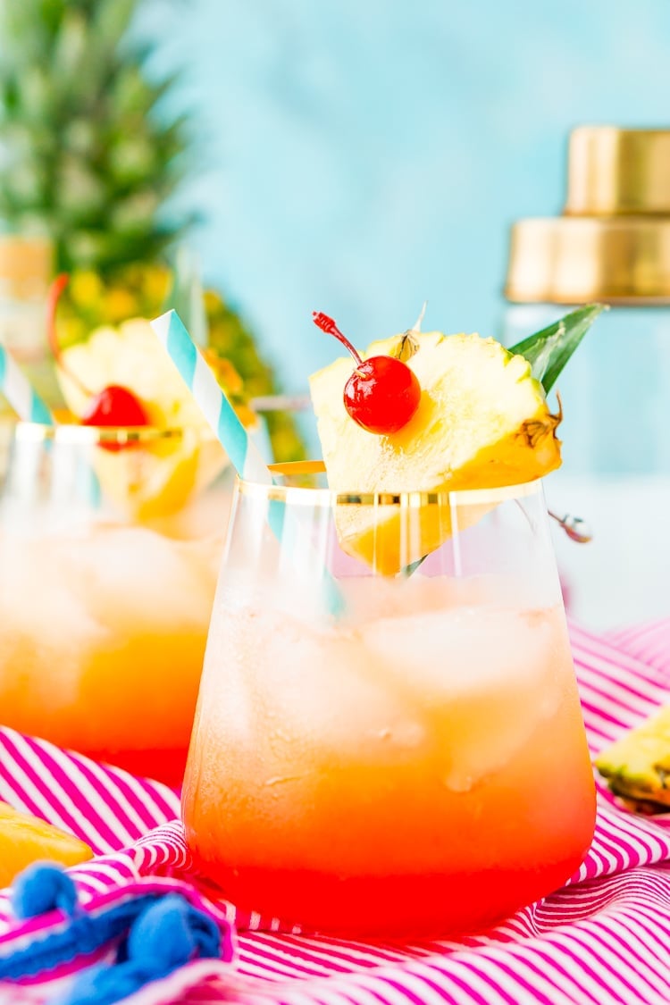 A Mai Tai is a boozy blend of coconut and spiced rum, triple sec, orange and pineapple juices, and a splash of grenadine. Mix up a batch for a taste of the tropics to enjoy with friends and family this summer.