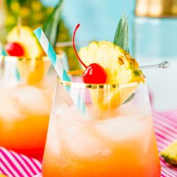 A Mai Tai is a boozy blend of coconut and spiced rum, triple sec, orange and pineapple juices, and a splash of grenadine. Mix up a batch for a taste of the tropics to enjoy with friends and family this summer.