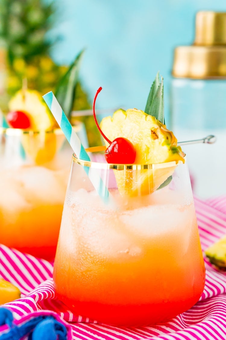 A Mai Tai is a boozy blend of coconut and spiced rum, triple sec, orange and pineapple juices, and a splash of grenadine. Mix up a batch for a taste of the tropics to enjoy with friends and family this summer.