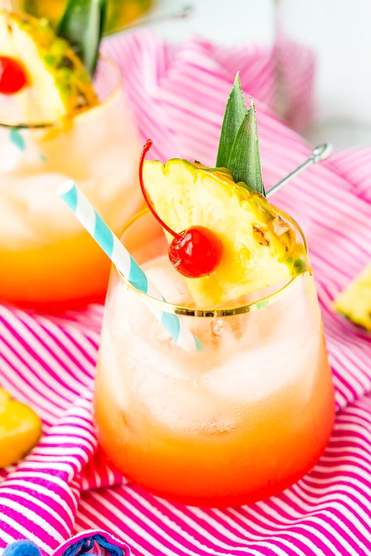 A Mai Tai is a boozy blend of coconut and spiced rum, triple sec, orange and pineapple juices, and a splash of grenadine. Mix up a batch for a taste of the tropics to enjoy with friends and family this summer.