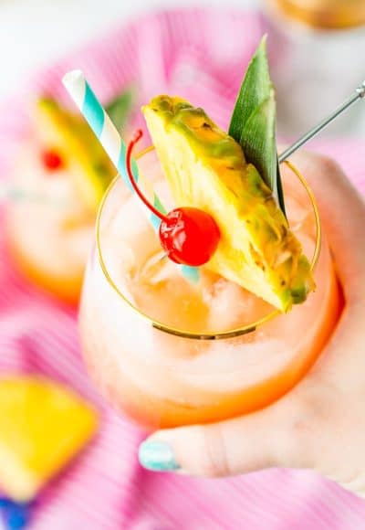 A Mai Tai is a boozy blend of coconut and spiced rum, triple sec, orange and pineapple juices, and a splash of grenadine. Mix up a batch for a taste of the tropics to enjoy with friends and family this summer.