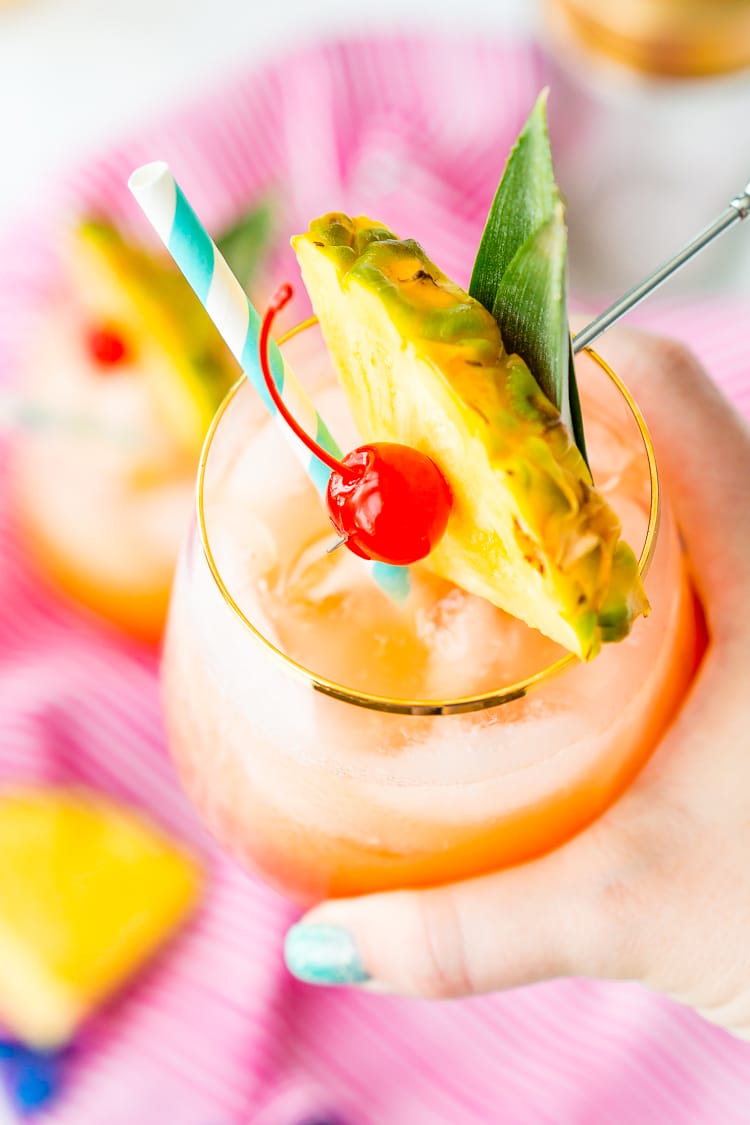 A Mai Tai is a boozy blend of coconut and spiced rum, triple sec, orange and pineapple juices, and a splash of grenadine. Mix up a batch for a taste of the tropics to enjoy with friends and family this summer.