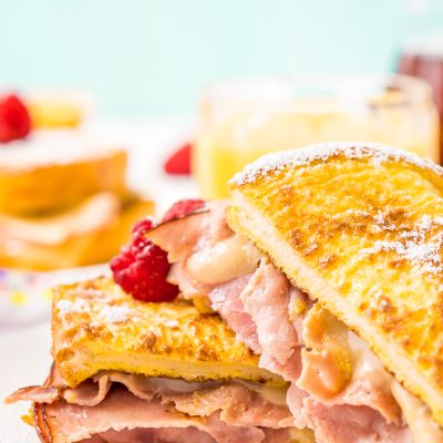 The Monte Cristo Sandwich is a breakfast twist on a classic ham and cheese. Tender slices of deli ham are sandwiched between two pieces of French toast and melty cheese for an addictive dish you'll want to make over and over again!