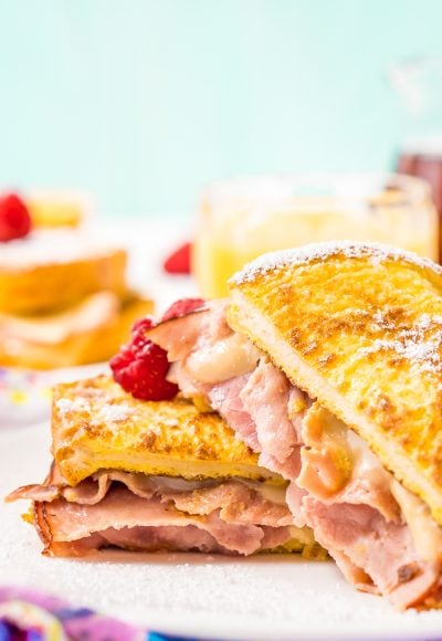 The Monte Cristo Sandwich is a breakfast twist on a classic ham and cheese. Tender slices of deli ham are sandwiched between two pieces of French toast and melty cheese for an addictive dish you'll want to make over and over again!