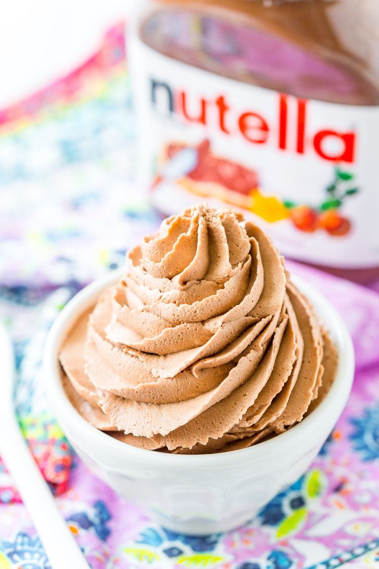 Nutella Frosting adds chocolate and hazelnut flavors to a traditional buttercream recipe. Made with Nutella, butter, powdered sugar, and heavy cream, this whipped Hazelnut Frosting is totally addictive!