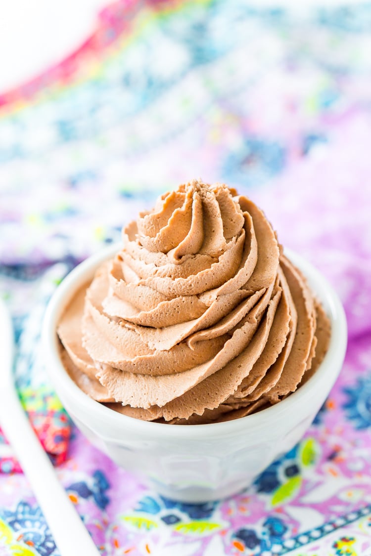 Nutella Frosting adds chocolate and hazelnut flavors to a traditional buttercream recipe. Made with Nutella, butter, powdered sugar, and heavy cream, this whipped Hazelnut Frosting is totally addictive!