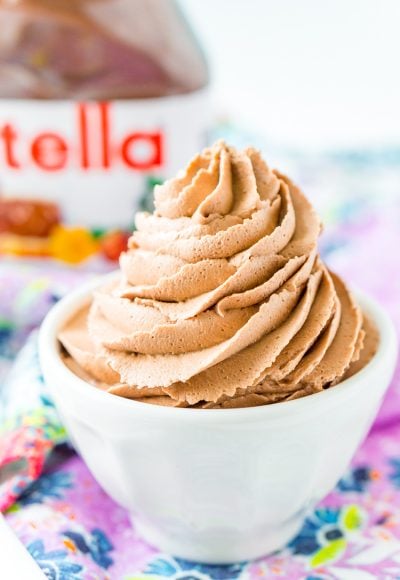 Nutella Frosting adds chocolate and hazelnut flavors to a traditional buttercream recipe. Made with Nutella, butter, powdered sugar, and heavy cream, this whipped Hazelnut Frosting is totally addictive!