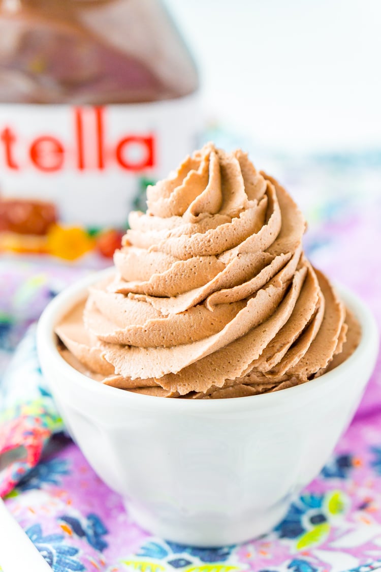 Nutella Frosting adds chocolate and hazelnut flavors to a traditional buttercream recipe. Made with Nutella, butter, powdered sugar, and heavy cream, this whipped Hazelnut Frosting is totally addictive!