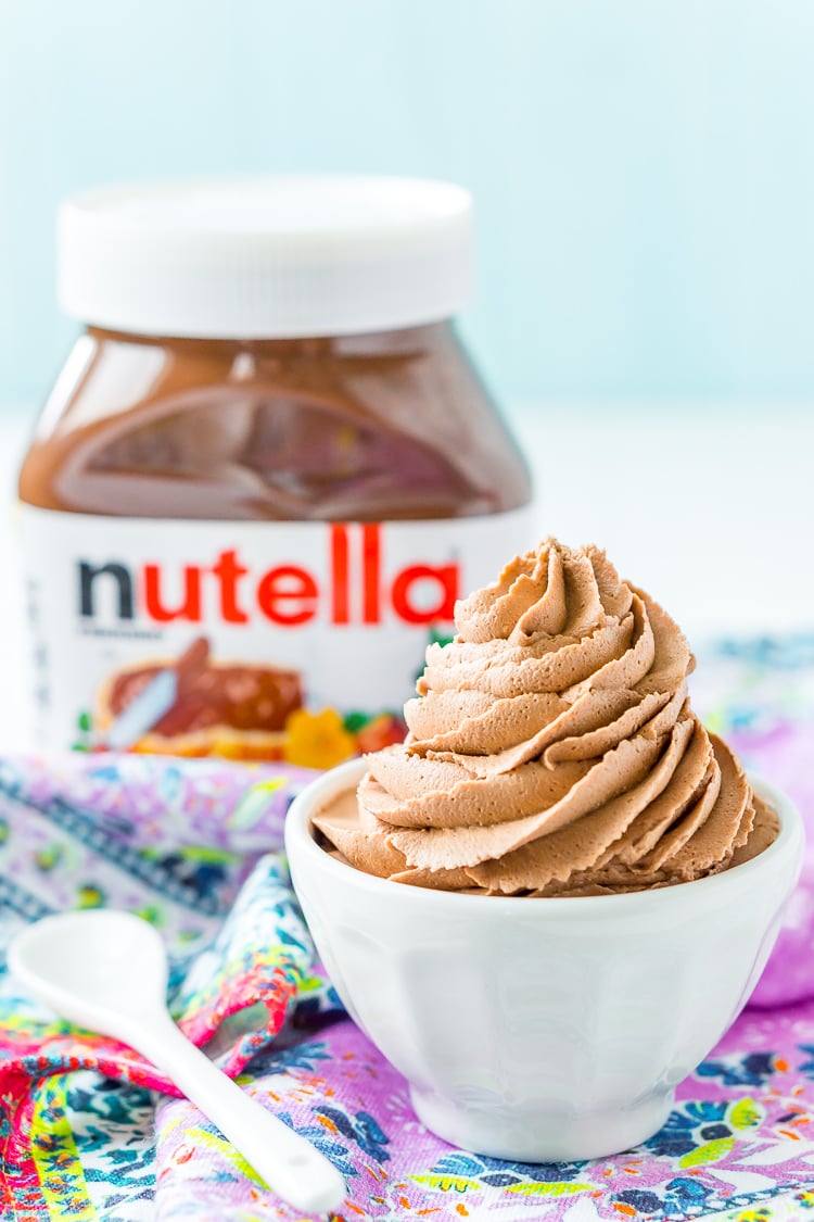 Nutella Frosting adds chocolate and hazelnut flavors to a traditional buttercream recipe. Made with Nutella, butter, powdered sugar, and heavy cream, this whipped Hazelnut Frosting is totally addictive!