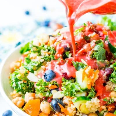 Raspberry Vinaigrette Dressing is delicious on summer salads and made with fresh raspberries, honey, red wine vinegar, olive oil, sea salt, black pepper, and garlic powder.