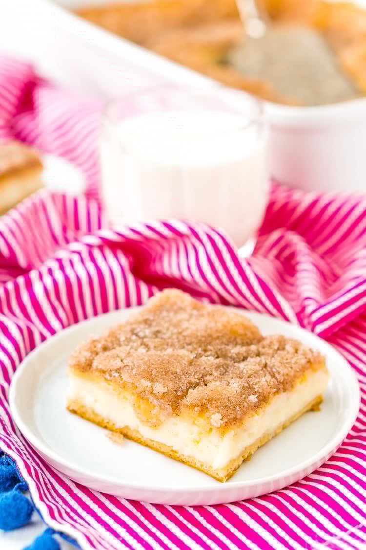 How To Make Sopapilla Cheesecake with crescent roll dough, cream cheese, sugar, butter, cinnamon, vanilla, and honey.
